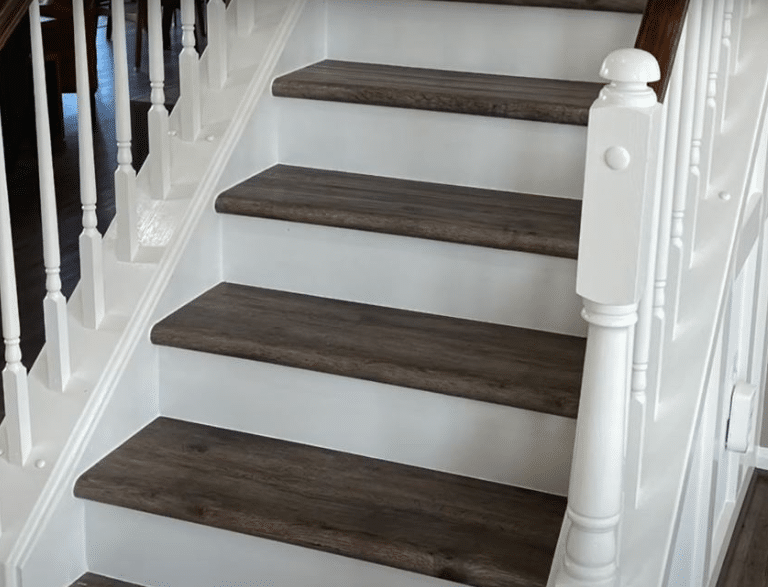 white staircase with bended vinyl flooring